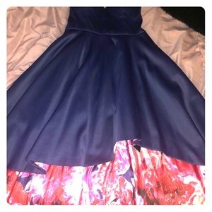 Navy blue with red and pink floral design skirt.